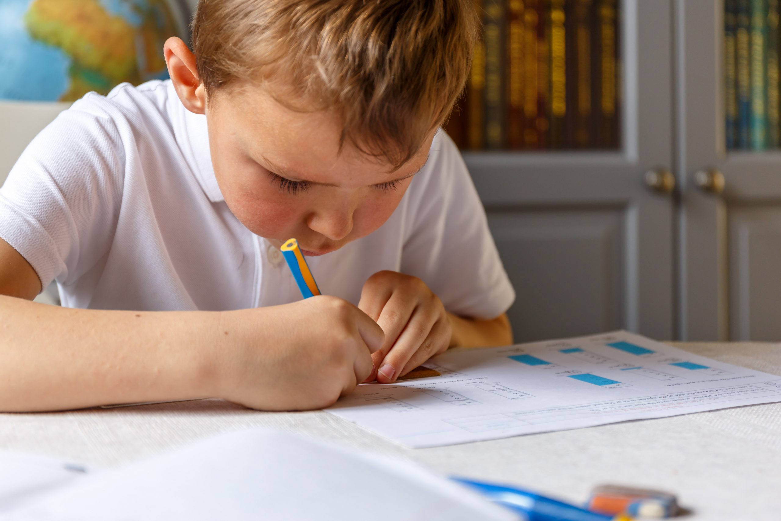 young boy doing his homework