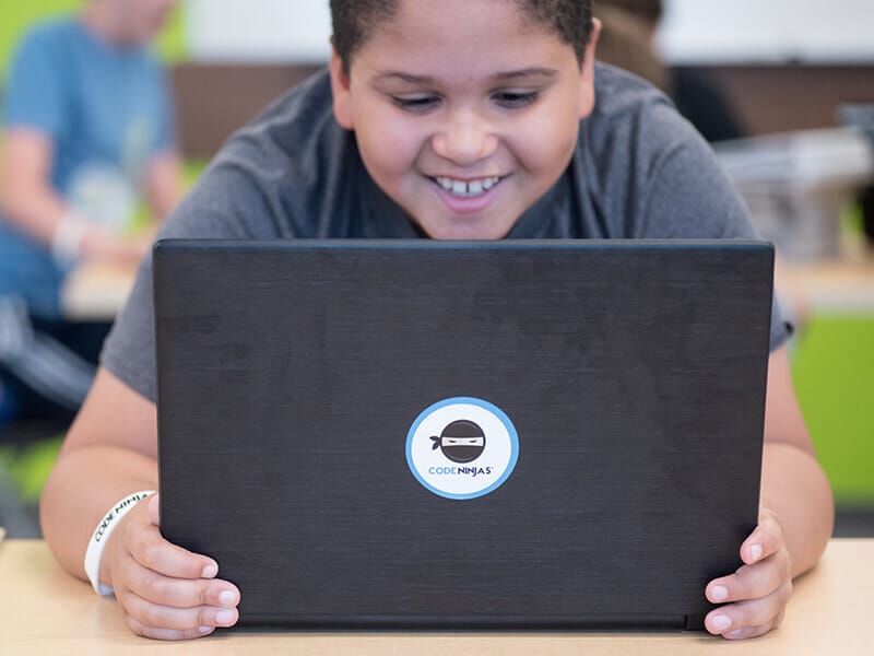boy happy with laptop